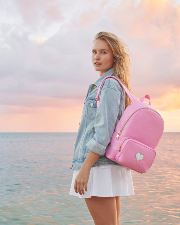 a woman in a pink jacket