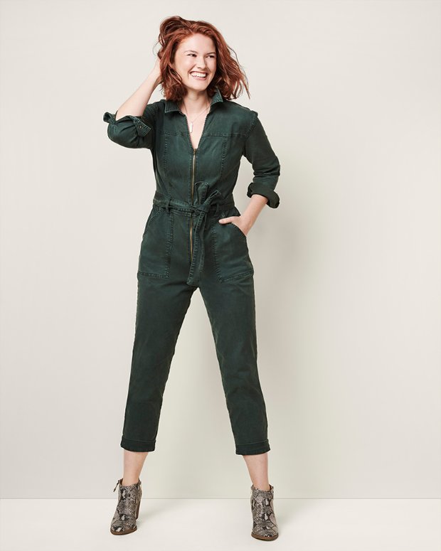 a woman in a green suit