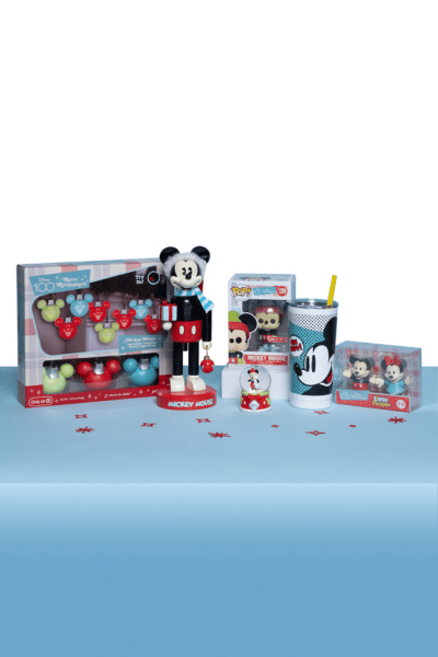 Display of Disney and Mickey Mouse themed items including stocking, doll, and tumbler with straw.