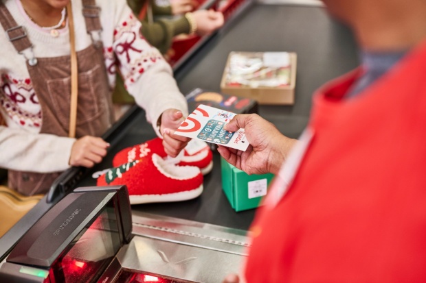 A detailed view of holiday products and giftcard in a check out lane inside a Target store.