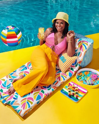 a woman sitting on a colorful chair