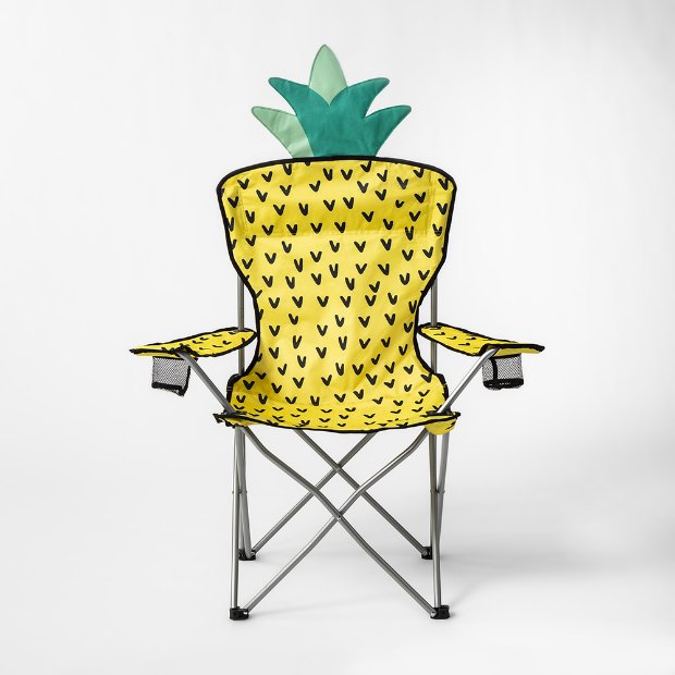 a yellow chair with a green bow