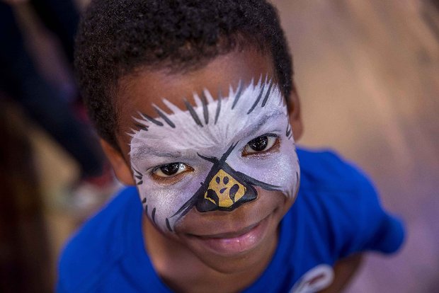 a boy with a face mask