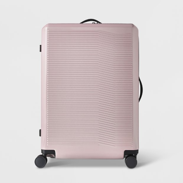 a pink suitcase with wheels