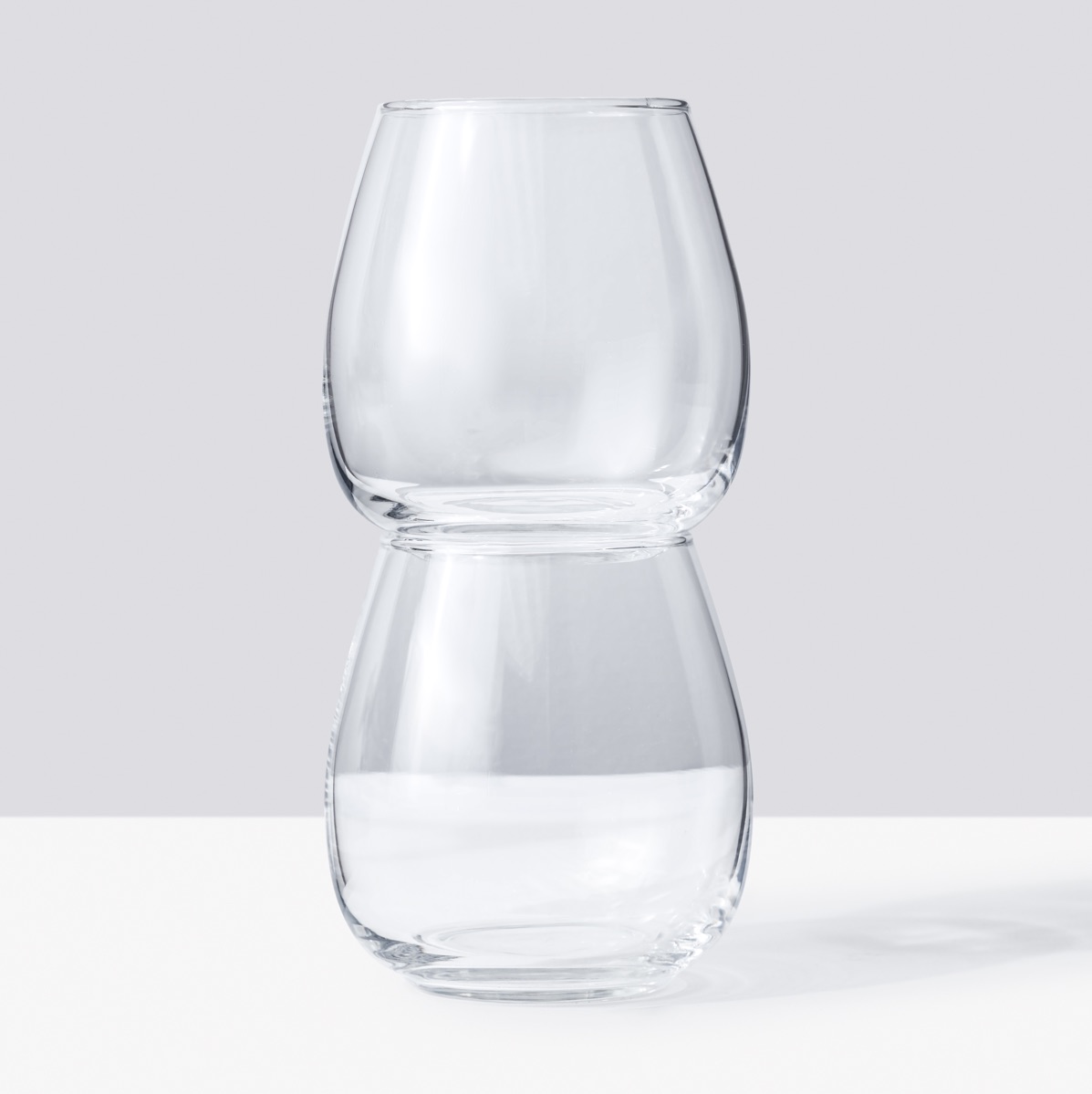 Two stemless wine glasses, stacked
