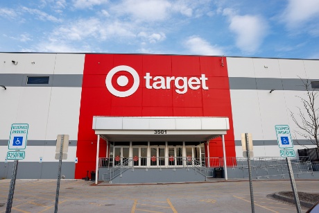 An image shows the front entrance of a Target flow center.