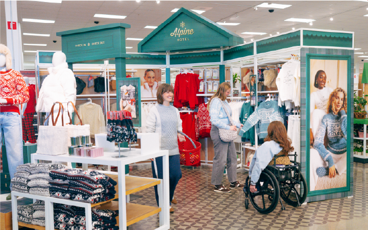 Guests browse the Alpine Hotel section of a Target store.