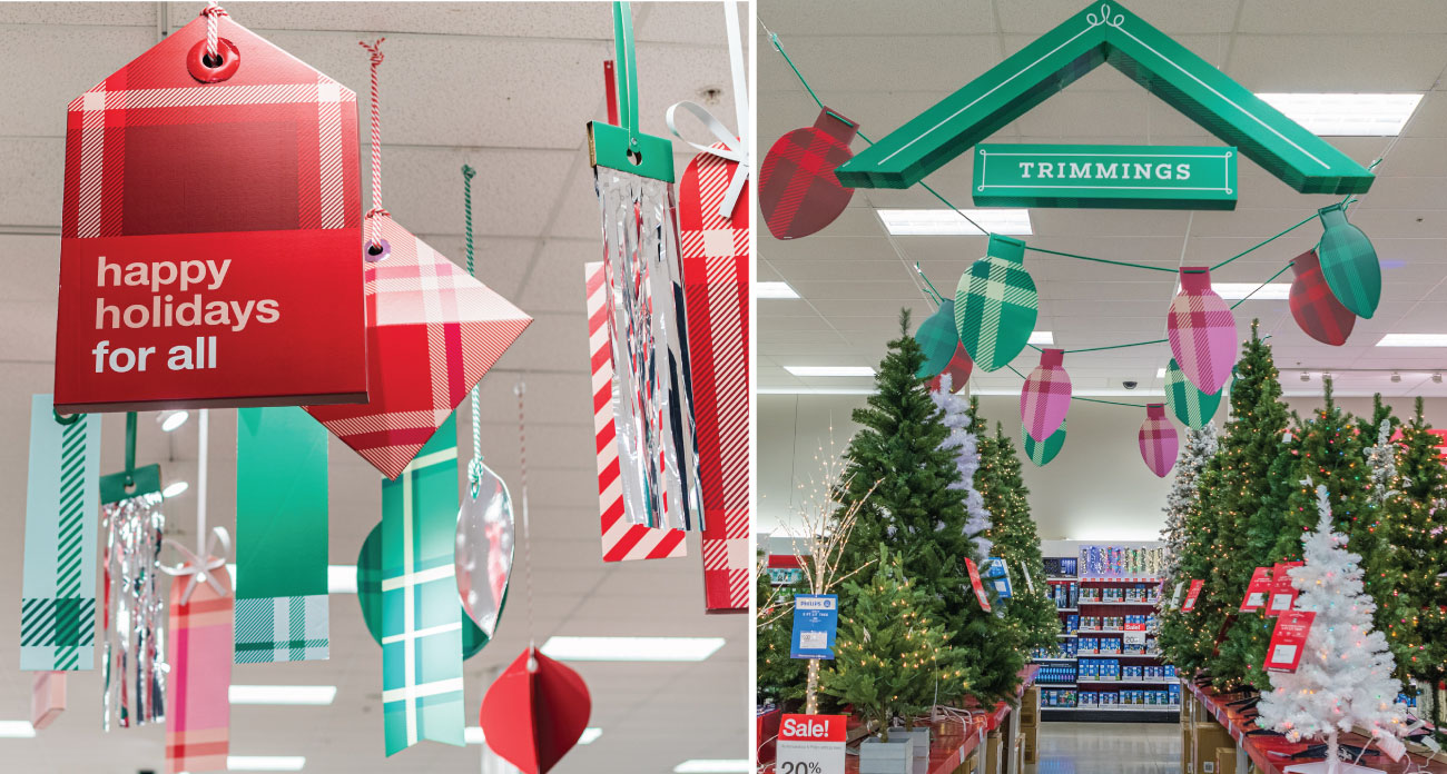 Festive plaid signs hang from the ceiling in a Target store