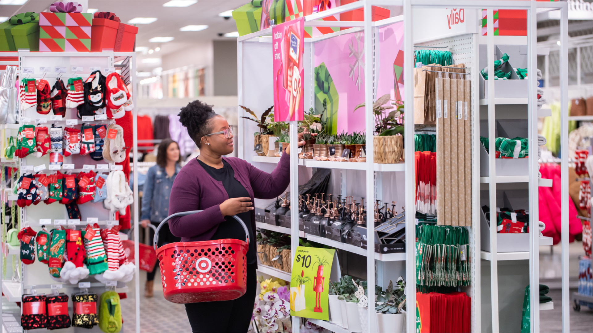 A Target guest shopping in a section full of holiday items.