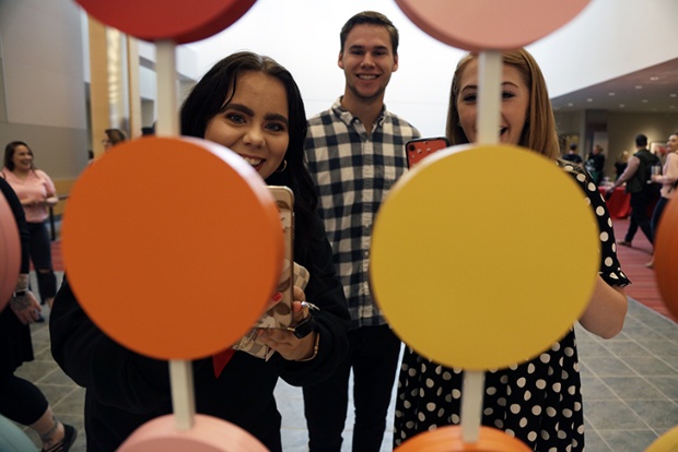 a group of people holding balloons