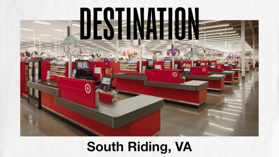 A video still with South Riding, Va., Store Director Joe R. walking down an aisle.