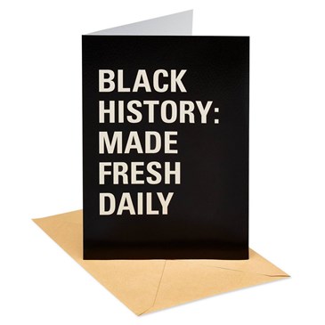 greeting card with white text on black background and yellow envelope