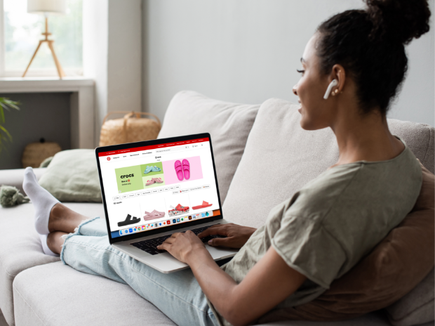 A person sitting on a sofa shopping Target Plus products on Target.com.
