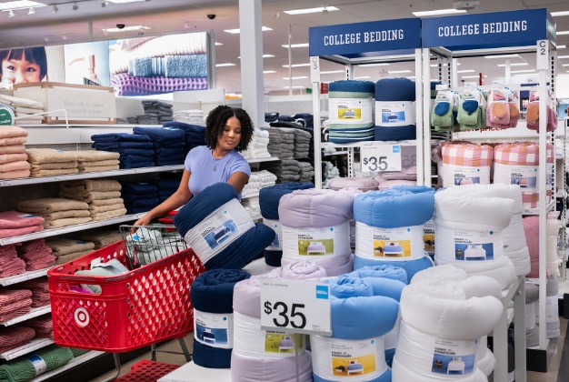 A Back-to-College display featuring a selection of essential bedding items for dorm rooms.