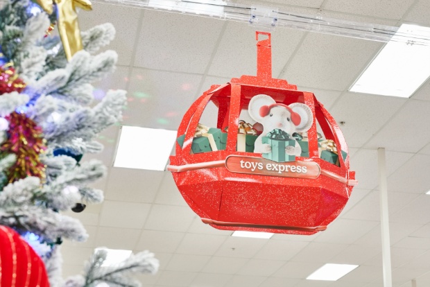 'Toys Express' red gondola decoration hanging above holiday aisle.