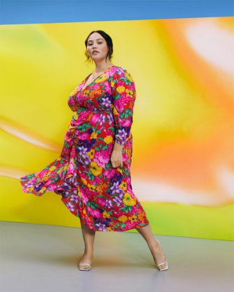 a woman wearing a colorful dress