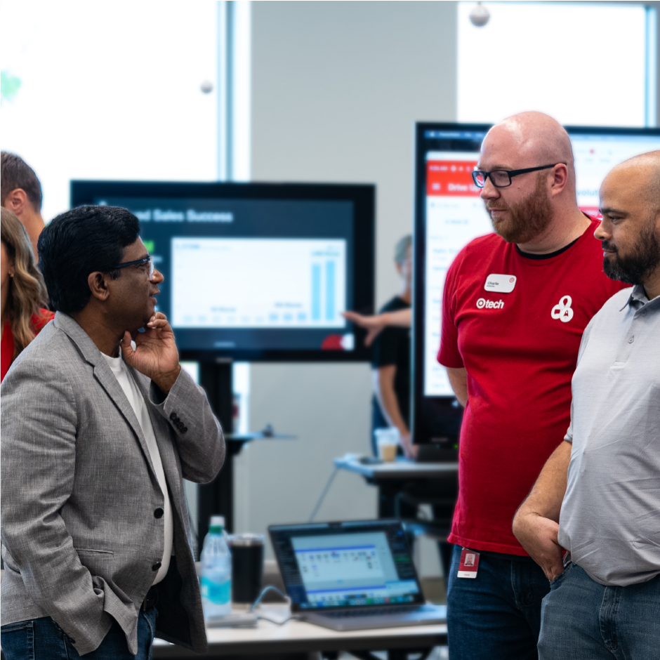 Prat Vemana listens to a team member presentation at Target Tech Demo Day.