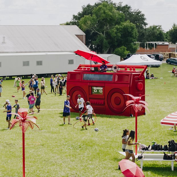 a group of people playing in a field