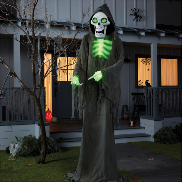 Bruce the Skeleton Ghoul with a green glowing chest standing in front of a house.