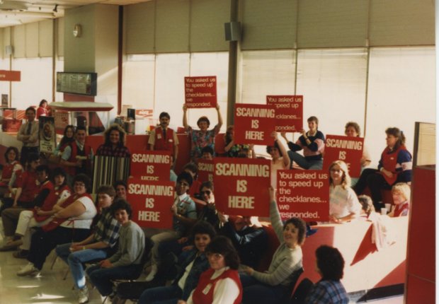 a group of people holding signs