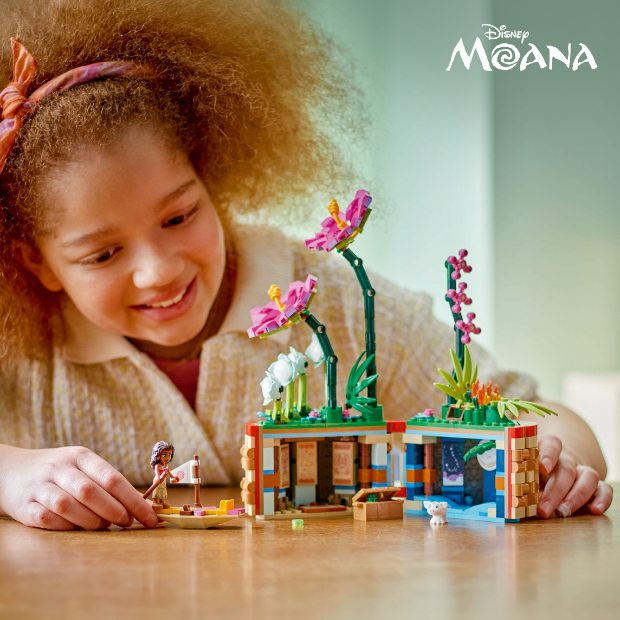 A child plays with a Moana-themed block set.