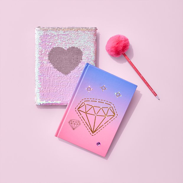 a few different colored notebooks