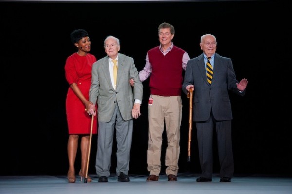a group of people standing on a stage