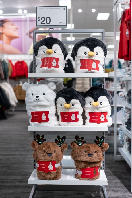 A display features Wondershop blankets shaped like penguins, bears and reindeer.