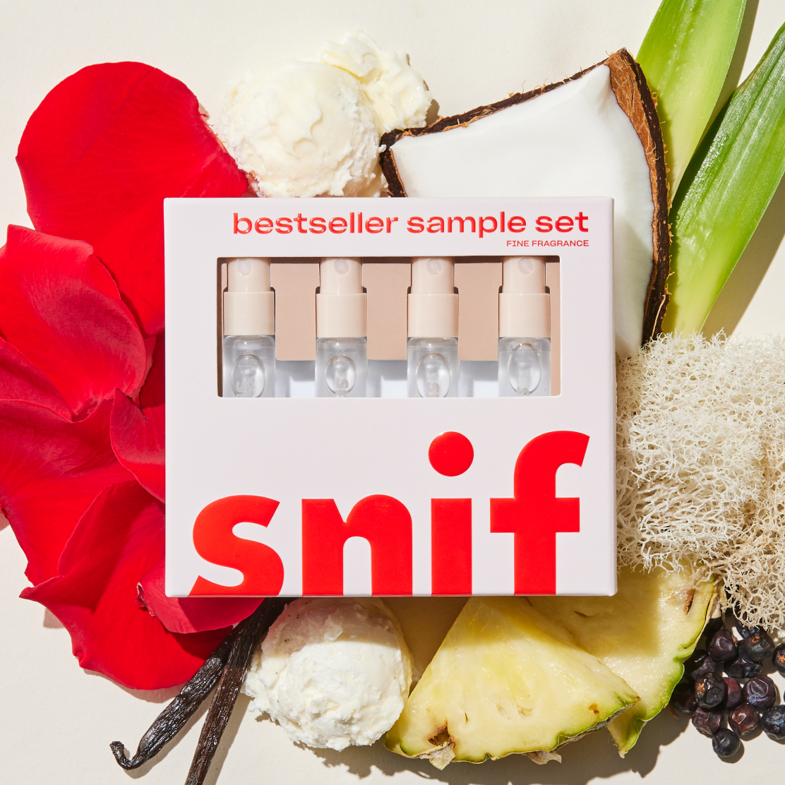 Bestseller sample set from Snif, laying on an array of flowers and fruit.