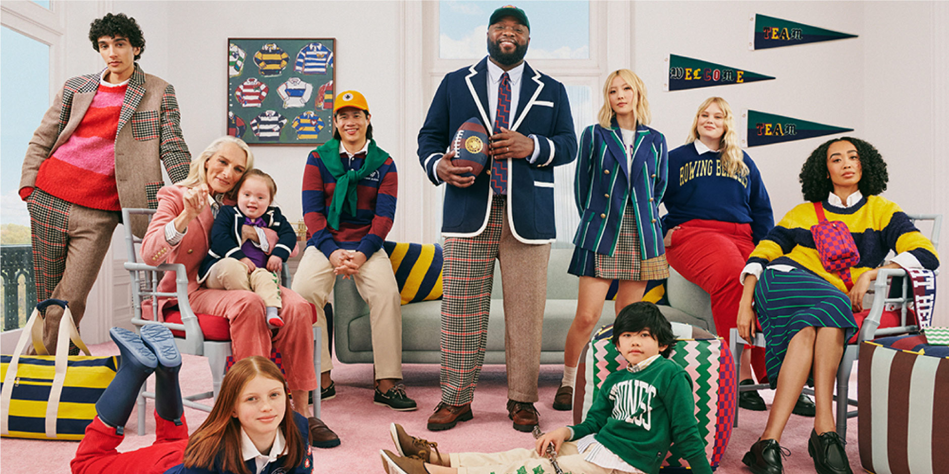 A group shot featuring models in patterned blazers and sweatshirts smiling at the camera.