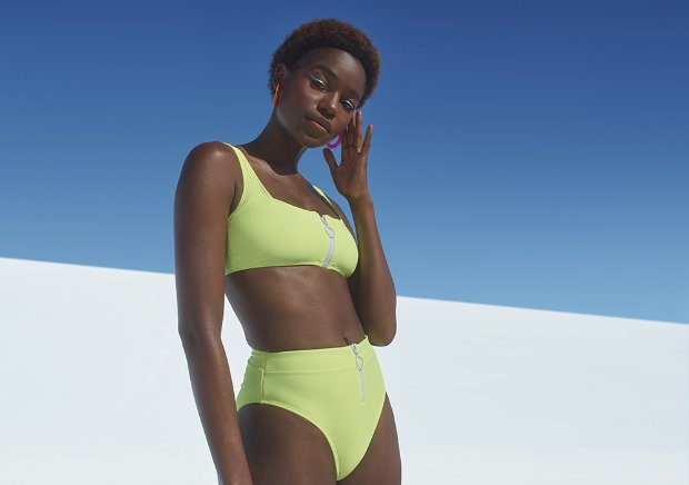 a woman in a green tank top