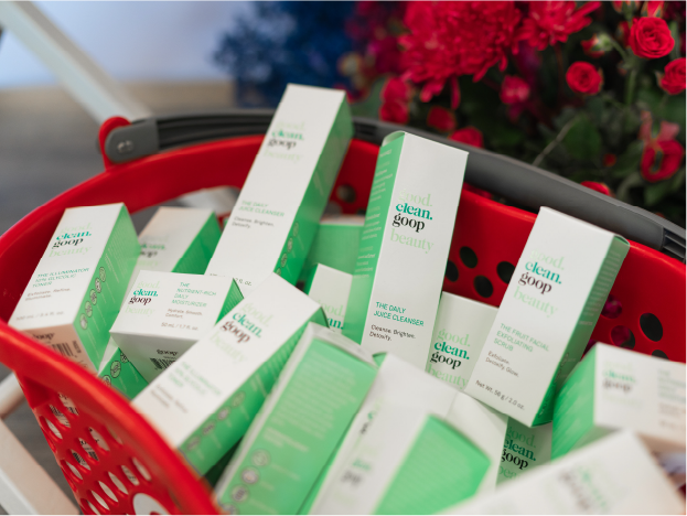 A red Target shopping basket filled with good.clean.goop products