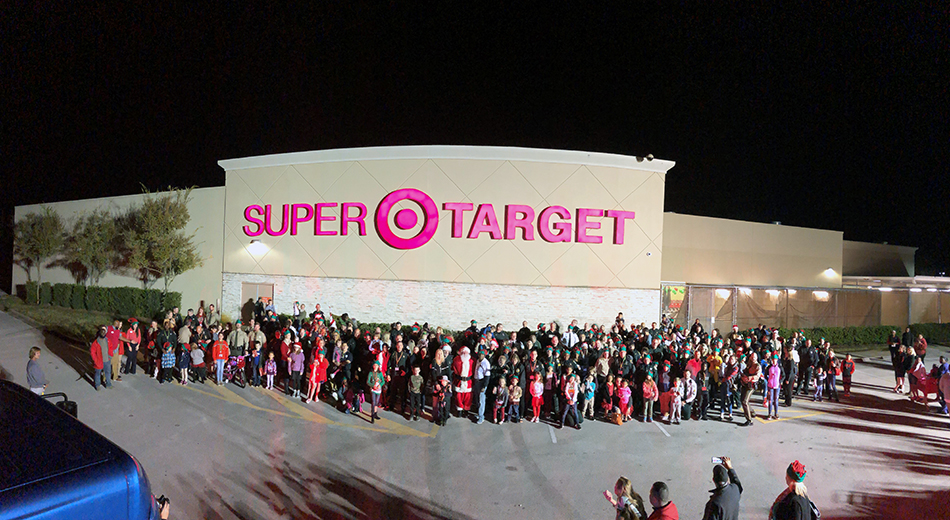 The large group of families and officers after the parade outside of the Target store.