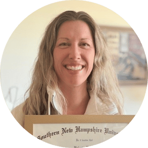 a Target team member smiles holding their certification