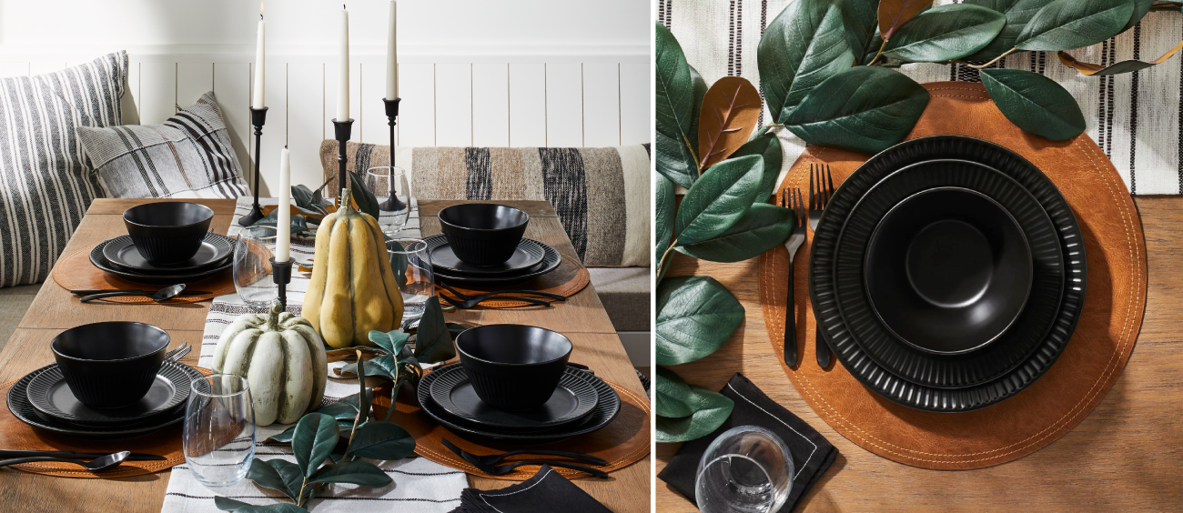 A modern tablescape, featuring black plates and accents  with pumpkins and greenery