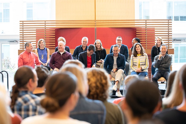 a group of people standing in front of a crowd