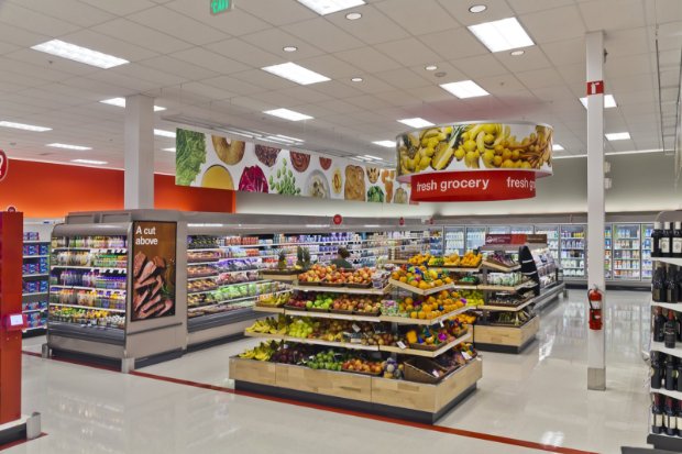 a grocery store with a display of fruits and vegetables