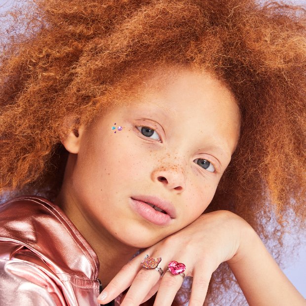 a baby with curly hair