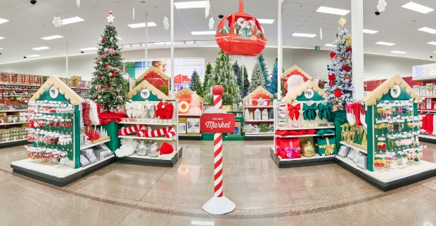 Wide view of the Holiday Market section featuring decorated trees, festive treats and a red gondola decoration overhead.
