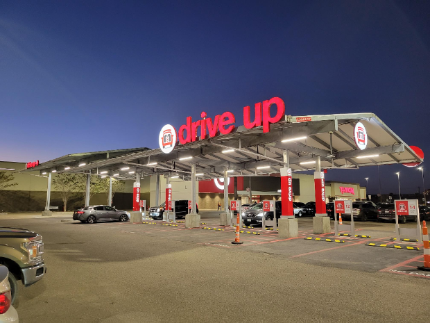 a gas station with cars parked at the gas station