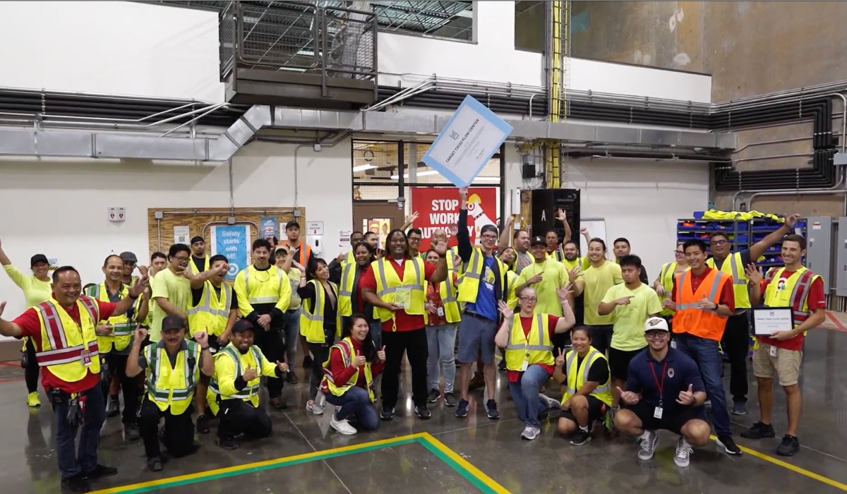 Dozens of Target’s Hawaii Flow Center team members wearing yellow safety vests.