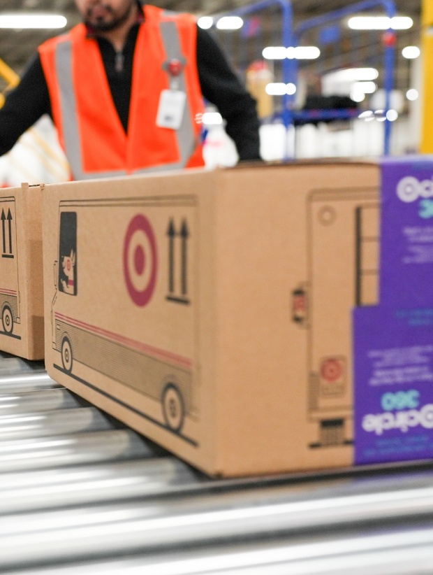 Target Bullseye branded boxes head down a conveyor belt.