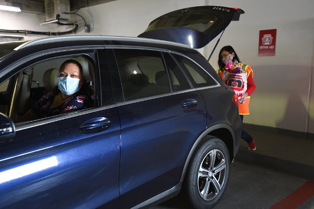 a person in a car with a mask on the face