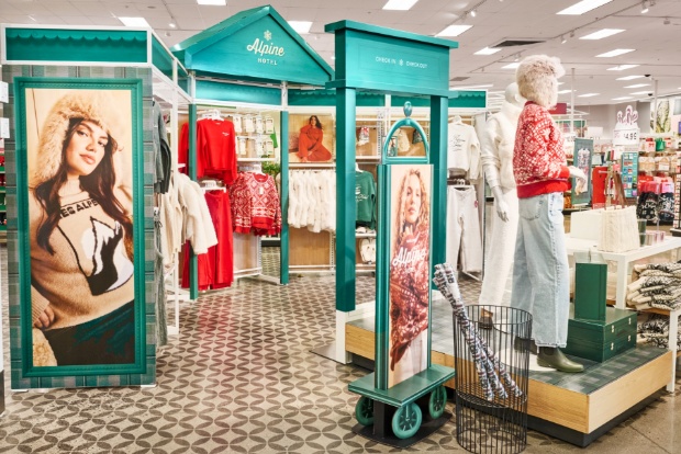 Apparel boutique with Alpine Hotel signage, sweaters and holiday décor accents.