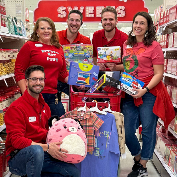 The store team from Target’s Port Charlotte, Florida, store poses with gifts they picked.