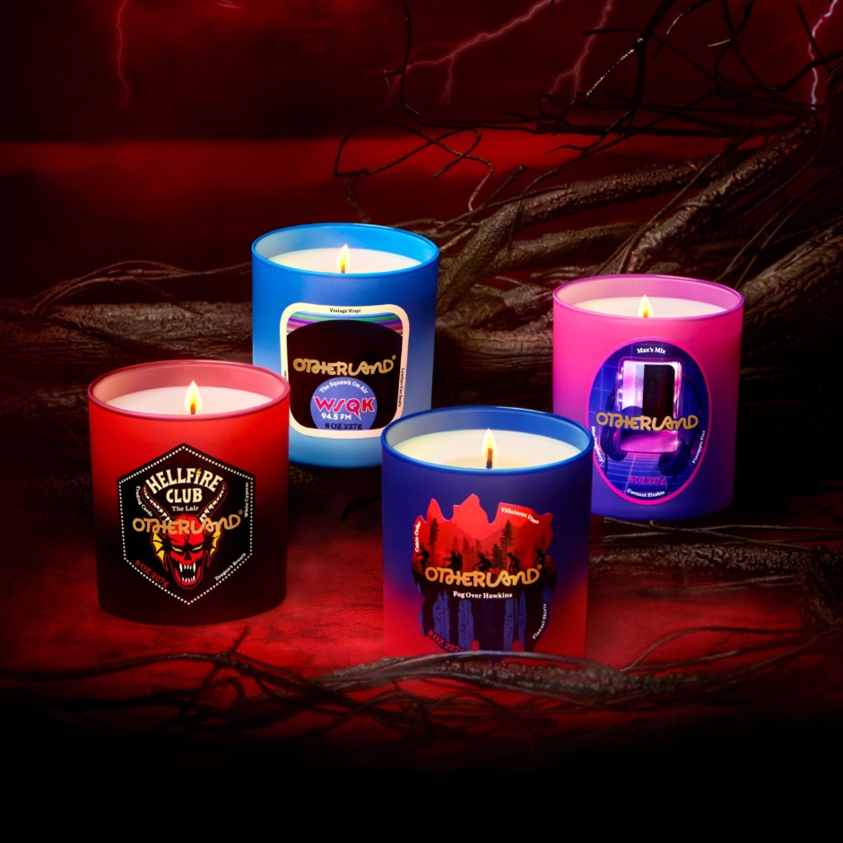 Four Stranger Things x Otherland white candles in colorful glass jars.