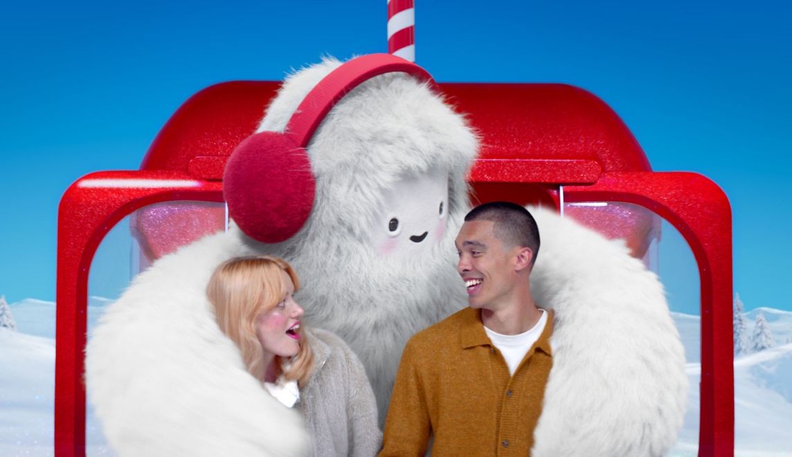 Target’s Get-Ready Yeti hugs two adults sitting in a red gondola.