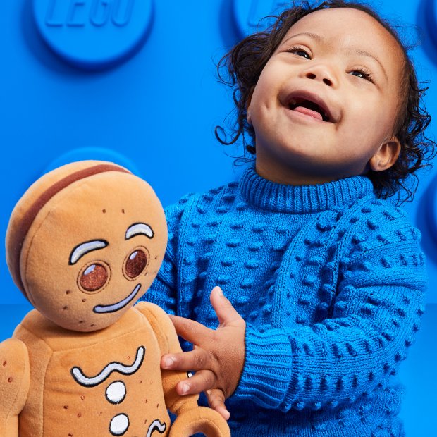 a child holding a stuffed animal