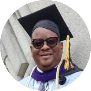 a man wearing a graduation cap and gown