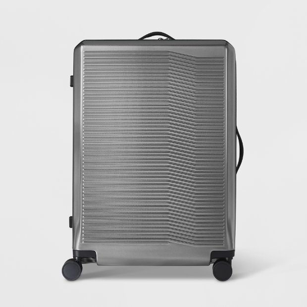 a grey suitcase with wheels